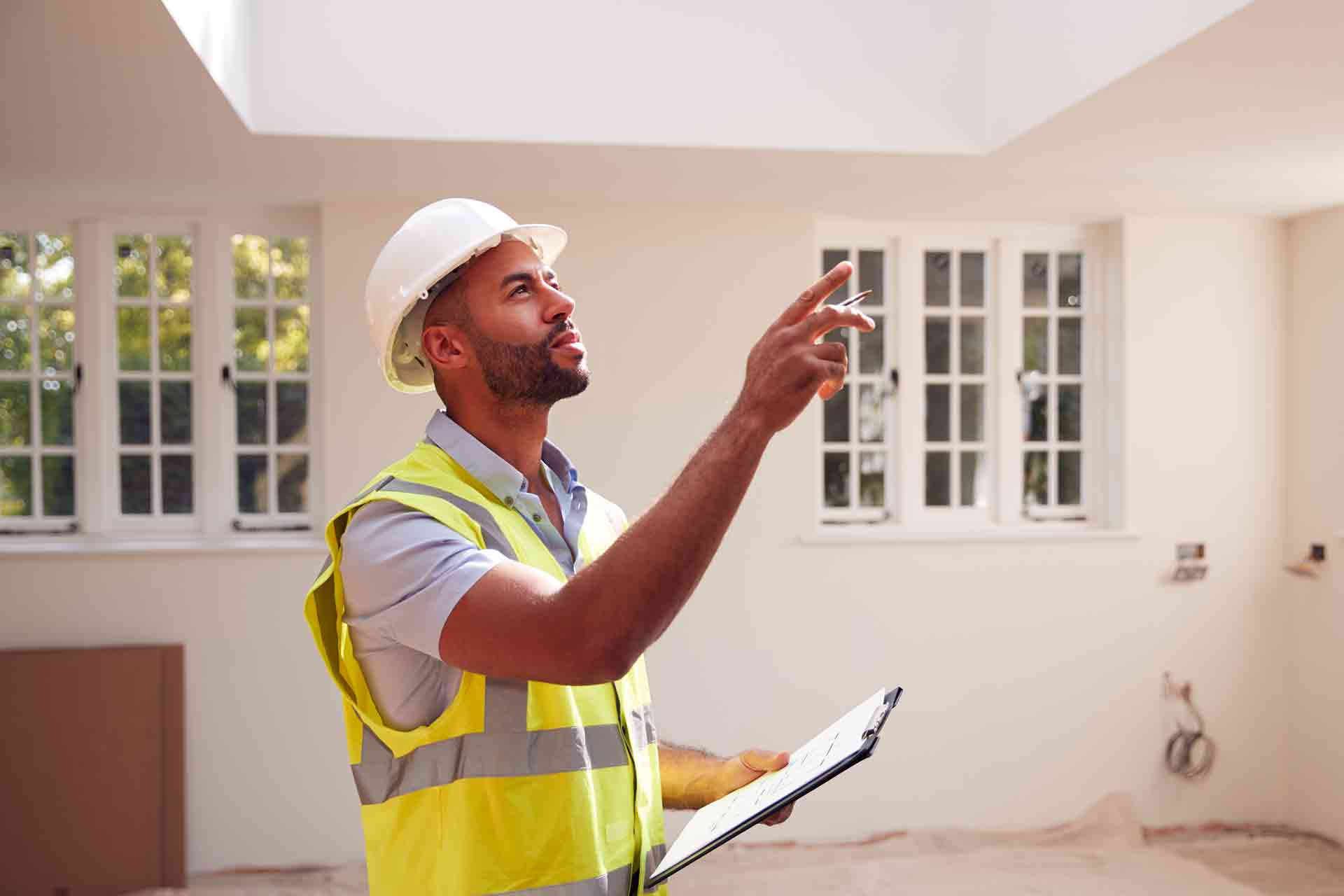 Third Party Wall Surveyors Wolverhampton reviewing plans between two parties during a dispute
